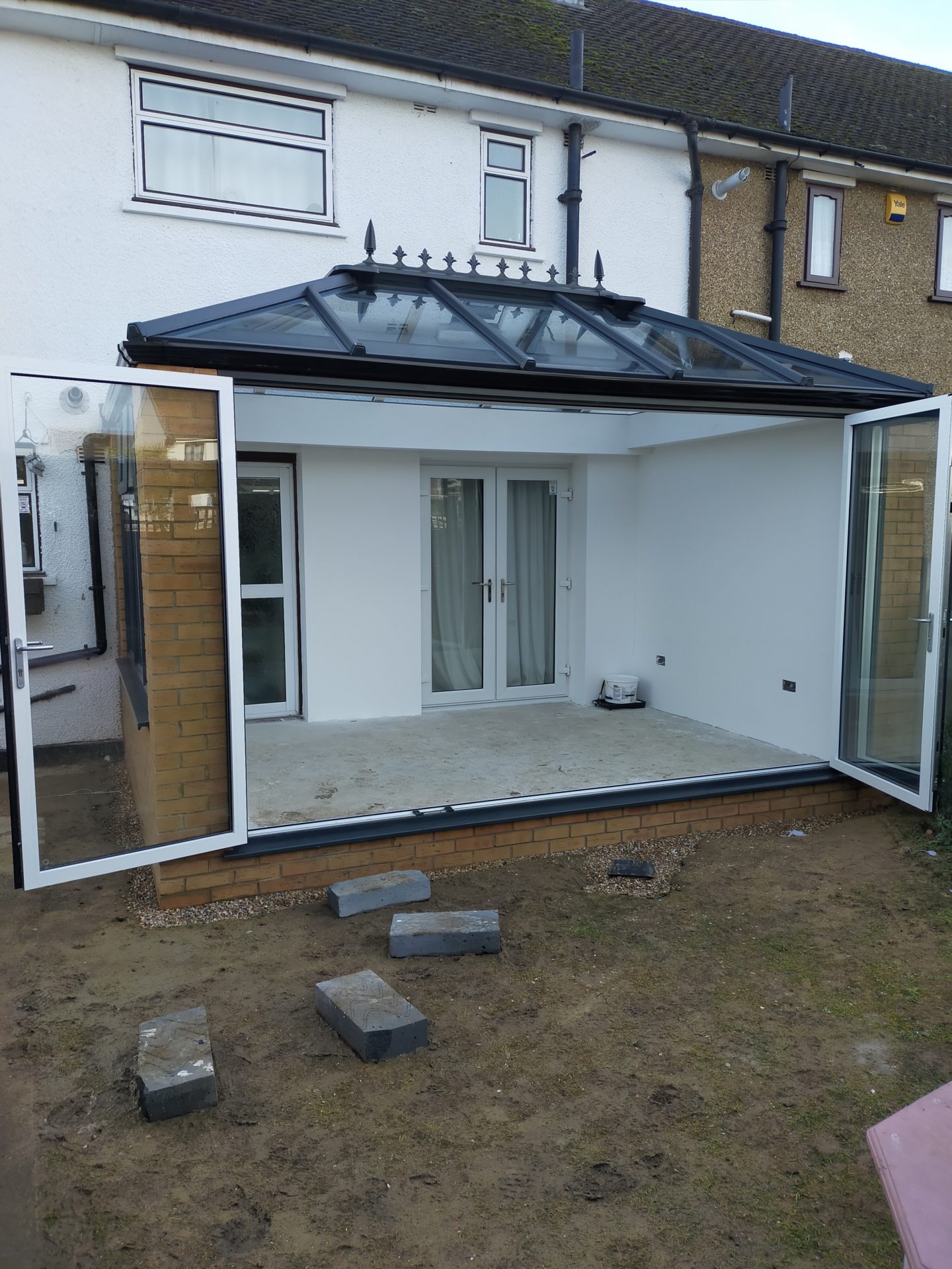 Double Edwardian Conservatory with four pane Bifold door.